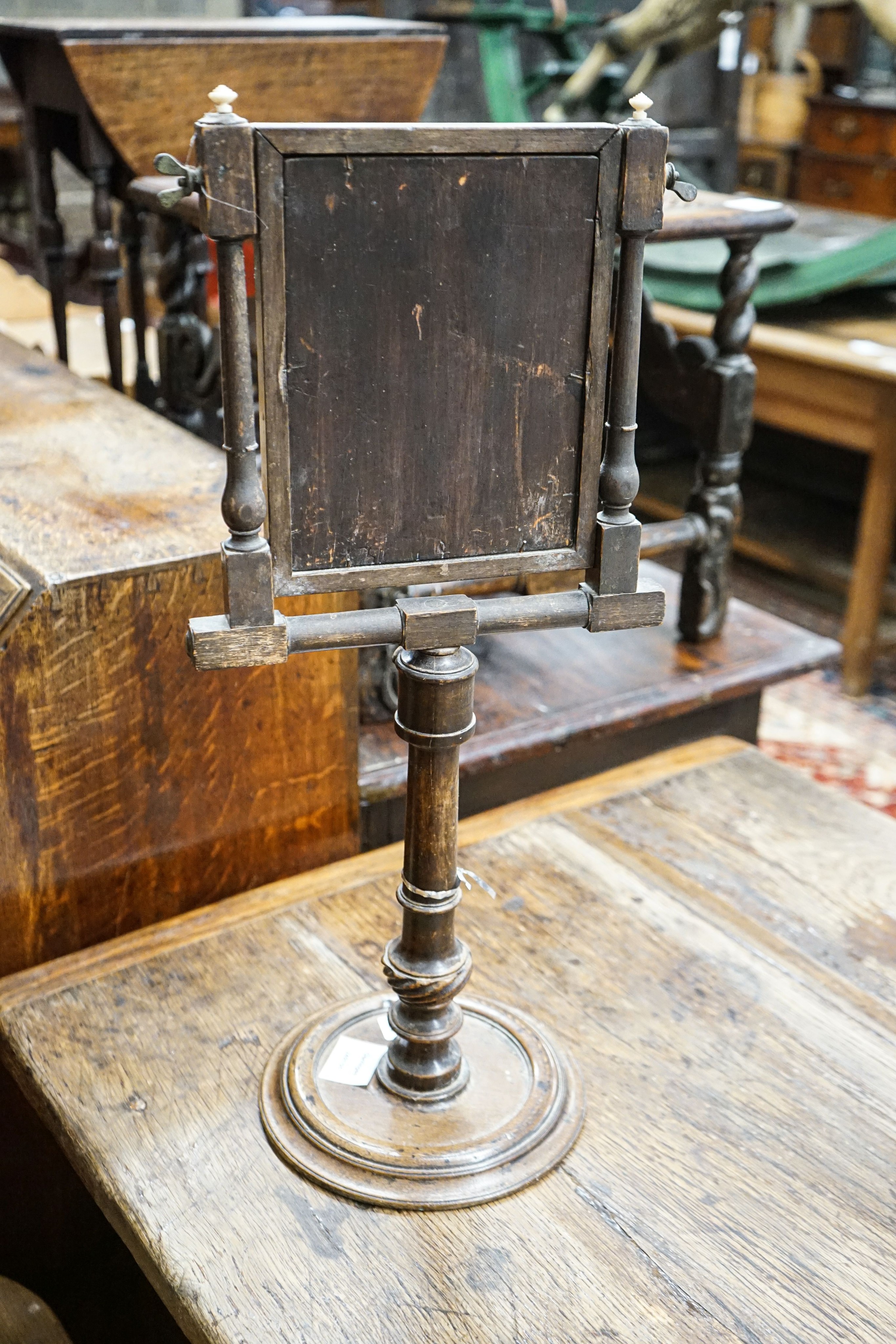 An antique stained beech and walnut telescopic shaving mirror, with barber's pole stringing, height 59cm